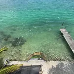 Casa Agua Bacalar / Naajil Ha
